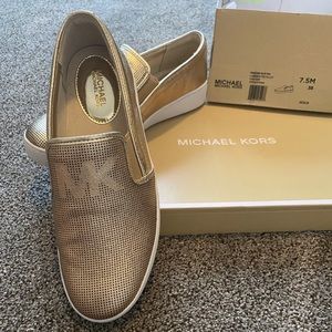 Brand new! Michael Kors gold shoes. 7.5 size.